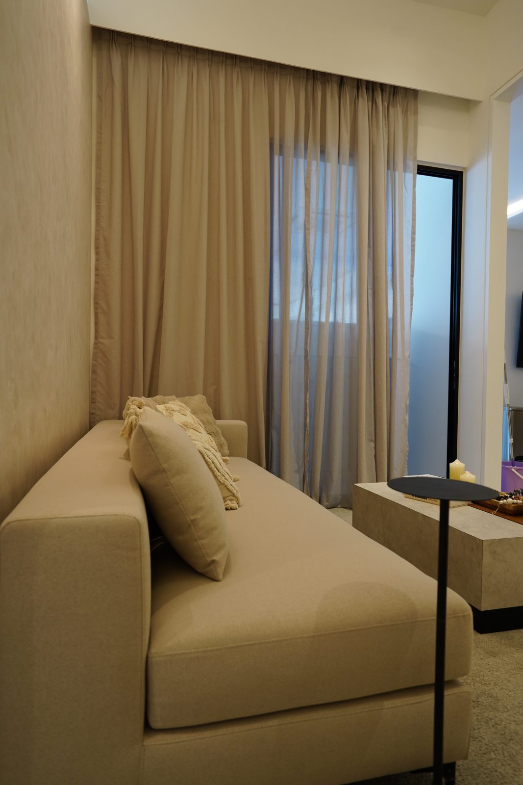 Light-filled living room interior at Arra Residences